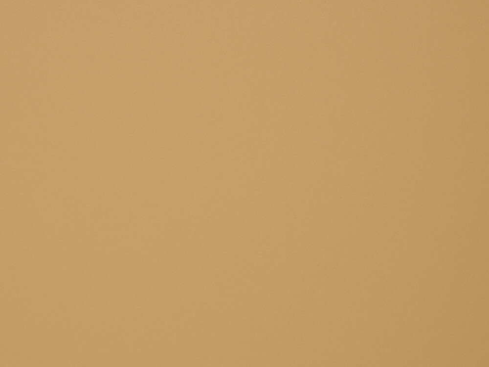 Nahaufnahme der Linoleum-Oberfläche in Leather von Faust – matt, fein strukturiert, in satt warmem Lederbraun mit sanfter Haptik.