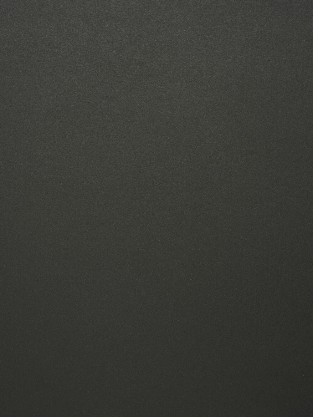 Linoleum-Oberfläche in Nero – matter, fein texturierter Belag in sattem Schwarz, dargestellt als Materialdetail einer Faust-Tischplatte.